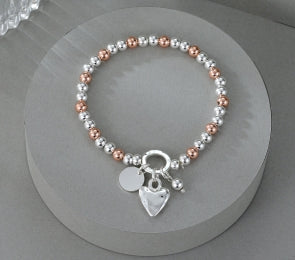 Silver and Rose Gold Heart Charm Bracelet
